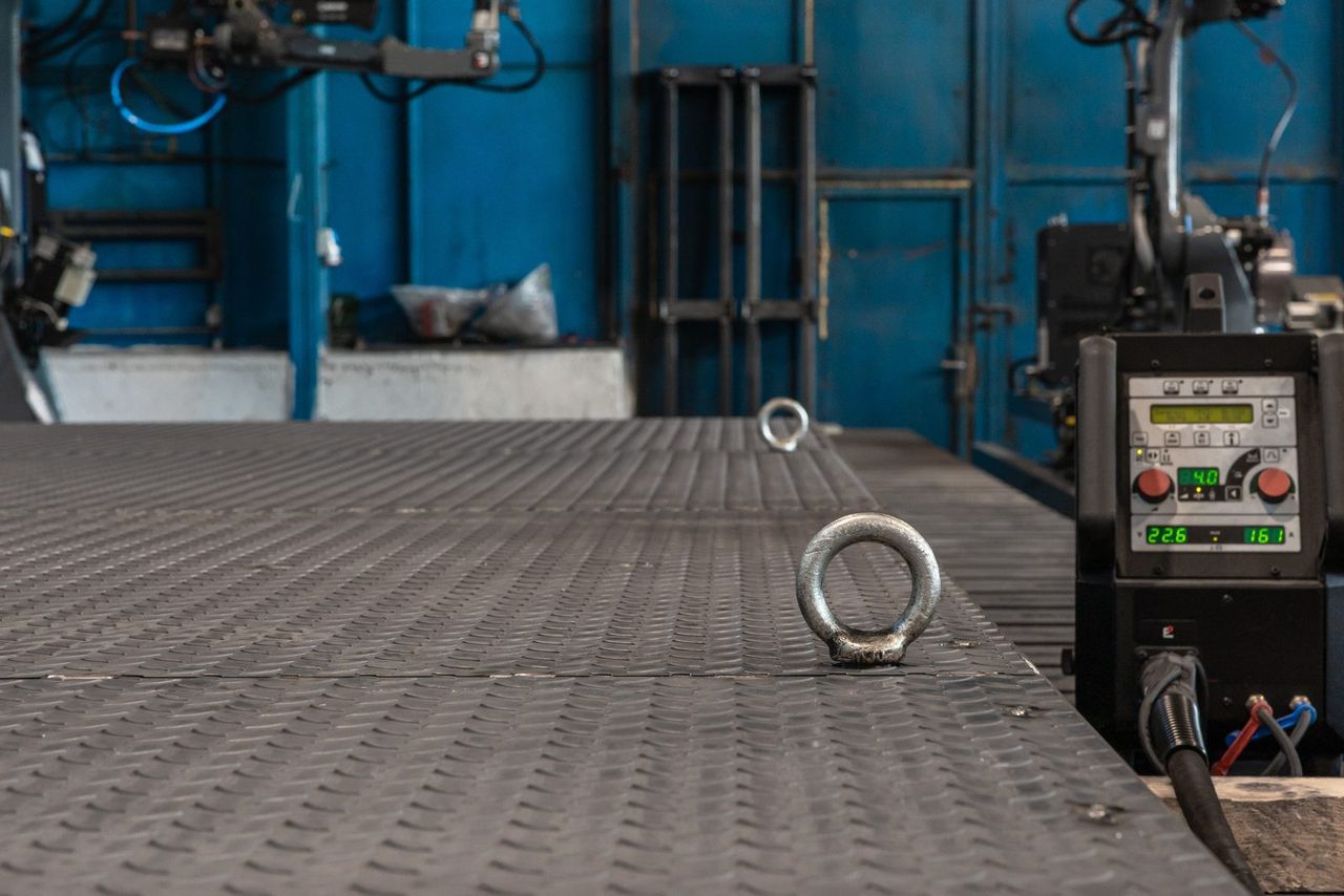 The container superstructure frame, lifted in the production hall