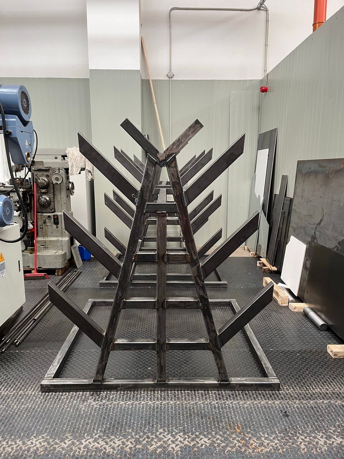 The double-sided sheet rack from the front, four levels of arms each side of the A-frame